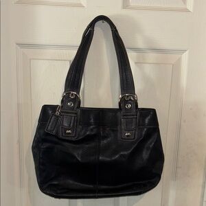 Black Leather Shoulder Bag with Structured Design.